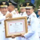 PJ Walikota Palembang Raih Penghargaan Bergengsi dari Mendagri di Hari Otonomi Daerah ke-28